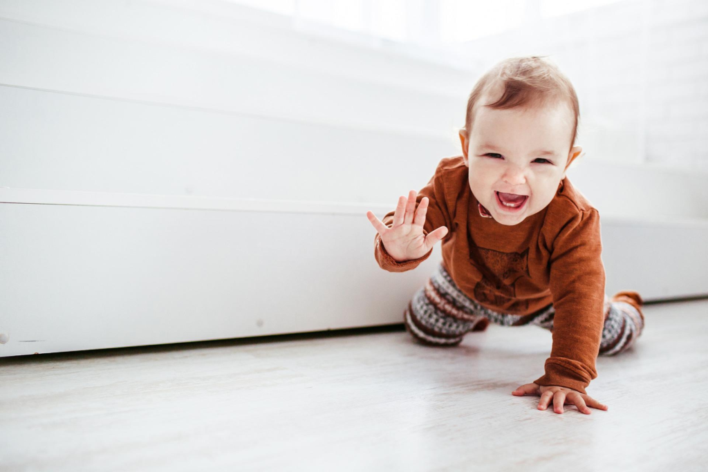 A baby confidently moving around on a sturdy and safe knee walker.