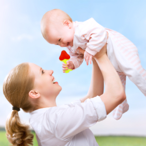 Parent placing a secure, adjustable teething mitten on their baby’s hand, ensuring a hassle-free teething experience.