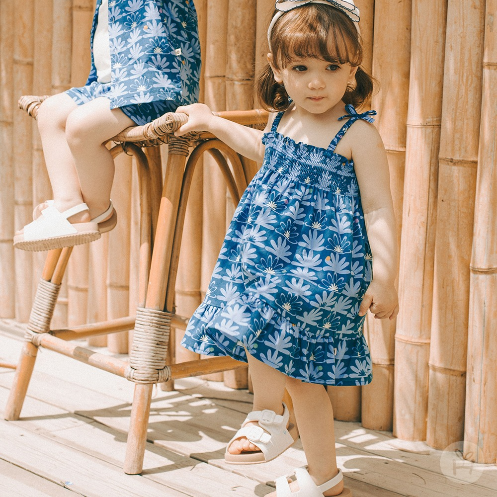 Adorable baby dressed in a trendy Tiny-Trends outfit, showcasing the latest in mini fashion.